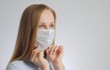 woman with medical mask. portrait of blonde girl. use and fit the protective mask poster
