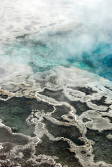 Sapphire blue hot spring pool in the Upper Geyser Basin of Yellowstone National Park