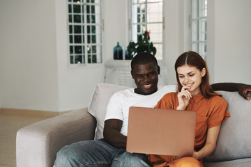 happy couple using laptop