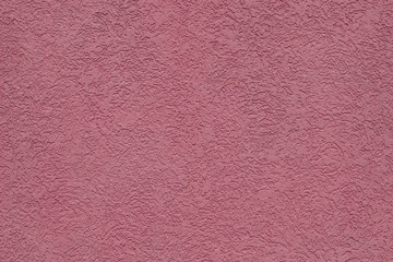 Rough pink wall texture background.