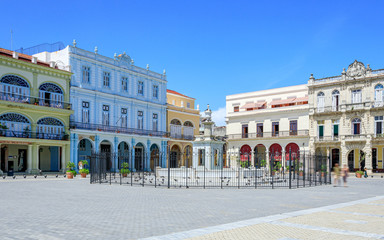 Fototapeta na wymiar Havana Cuba View of Plaza Vieja colored houses with a sunny blue sky.
