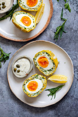 Scotch eggs wrapped with smoked haddock and cod