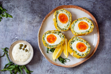 Scotch eggs wrapped with smoked haddock and cod