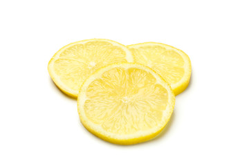 Lemons slices isolated on white background. Ripe fruit