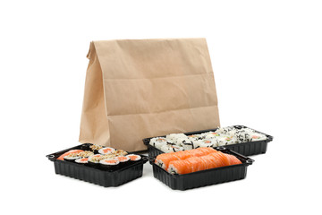 Containers with sushi isolated on white background. Food delivery
