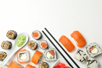 Delicious sushi rolls on white background, top view. Japanese food