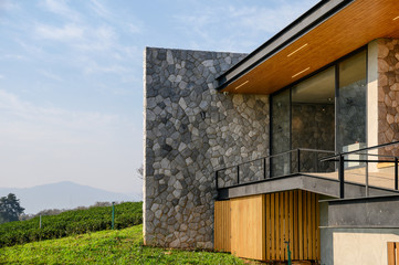 Modern luxury building with wood and rock on plantation