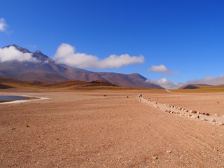 Morning road, mountains and clouds in the Atacama Desert, San Pedro de Atacama, Chile