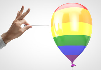 Man tries to puncture the balloon with LGBT symbols