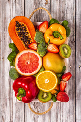 Fruits and vegetables rich in vitamin C in box. Healthy eating.