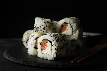 Tray with delicious sushi rolls, close up. Japanese food