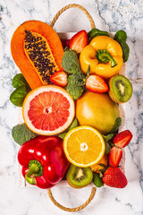 Fruits and vegetables rich in vitamin C in box. Healthy eating.