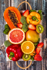 Fruits and vegetables rich in vitamin C in box. Healthy eating.
