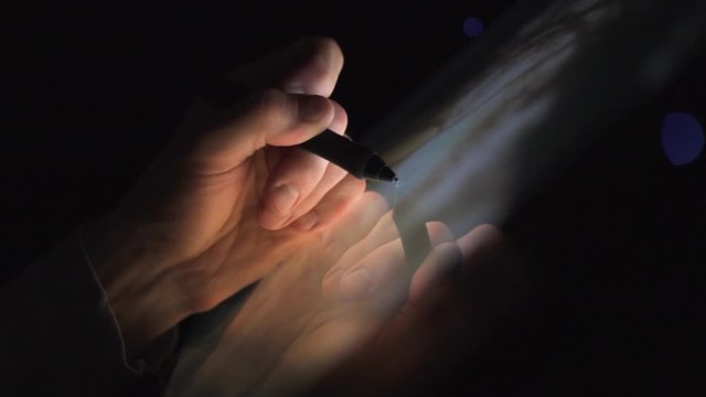 Working Remote employee. creative Digital artist photographer working from home edit his artwork on interactive digital tablet computer