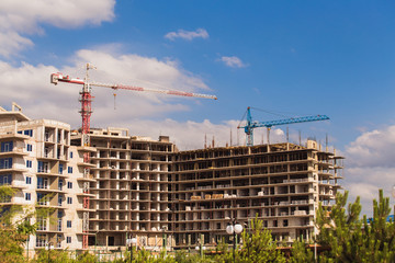 Construction site with crane on sky background