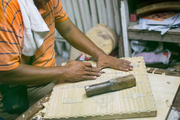 carpenter cutting wood