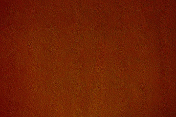 Red and green velvet fabric. The texture of red with a green tint of shiny velvet fabric. Red with a green tint background