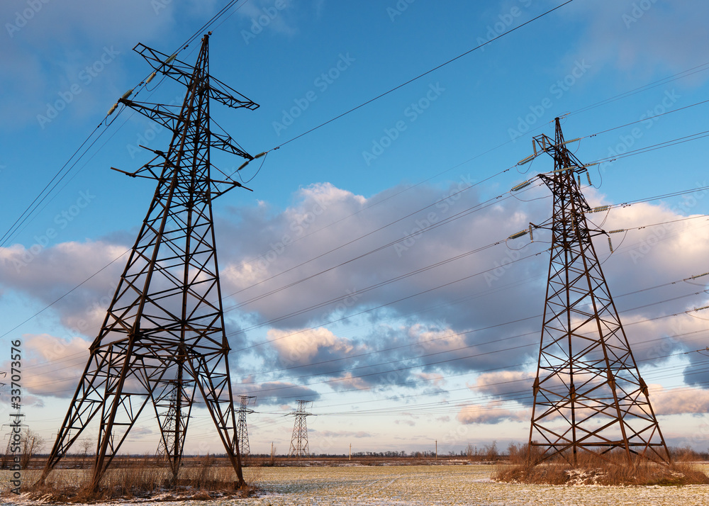 Wall mural power lines during a beautiful winter sunset.