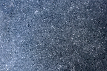 The texture of granite chips. Background of blue granite. Abstract blue background