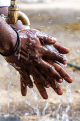Africa coronavirus pandemic prevention wash hands with soap warm water and , rubbing nails and fingers washing frequently