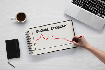 Hand drawing the global economy graph after COVID-19 (Coronavirus)