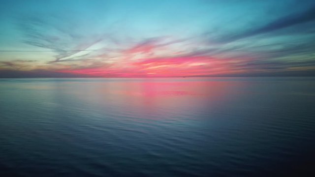 Dron Flying Over Sea in a Beautiful Sunset. Aerial Drone Shoot. Sunrise Over the Sea. Colorful Sunset on the Baltic Sea, Latvia. 