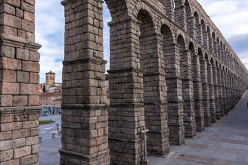 View of the beautiful city of Segovia, Castilla y León (Spain). Its famous Alcazar, Cathedral and Roman Aqueduct.