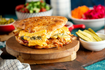 chicken burger with cheese vegetables and fries