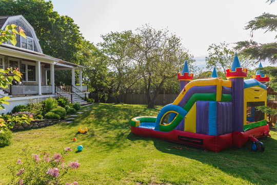 Bounce House in Backyard of Suburban Home