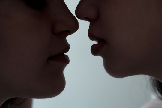 Women about to kiss
