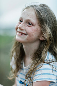 Portrait of Pretty young Redhead girl with Freckles laughing