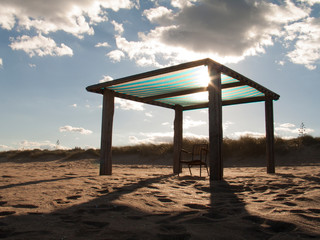 beach hut at sunset