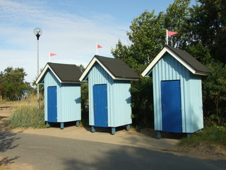 Fototapeta na wymiar three beach toilets