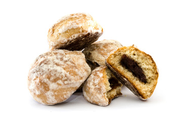 cookies in white icing with apricot jam inside. Halved cookies. White background.
