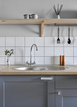 Stylish kitchen with gray furniture