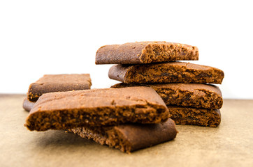 Tasty cookies with jam on a wooden table. Close-up. Rectangular cookies.