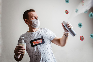 masked man with gloves disinfects covid 19 virus