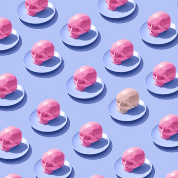 Pattern of pink skulls in ceramic plates on a purple background