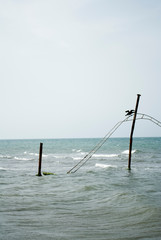 Fototapeta premium A view of the old swing in the sea