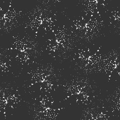 Seamless pattern, white dots randomly scattered on a dark background. Spray texture. Vector.