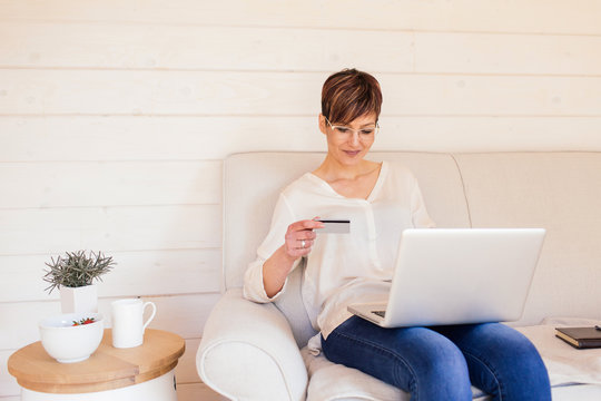 Middle age businesswoman using a credit card