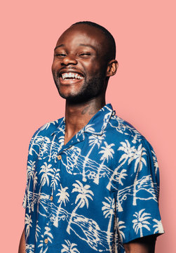 Portrait of handsome black man looking at camera and laughing
