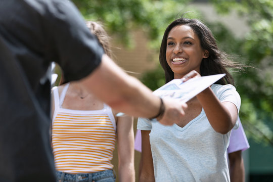 Tour: Guide Hands Out Information To Prospective Students