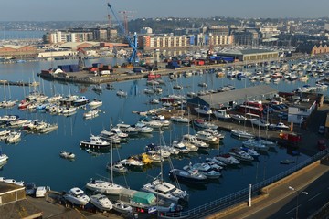 Fototapeta na wymiar St Helier harbour, Jersey, U.K. The islands port and capital with a high Spring tide.