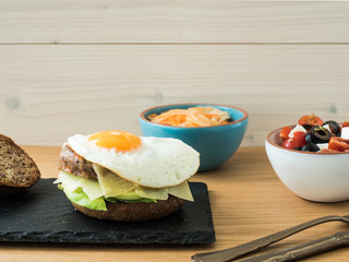 vegetarian cheeseburger and salads