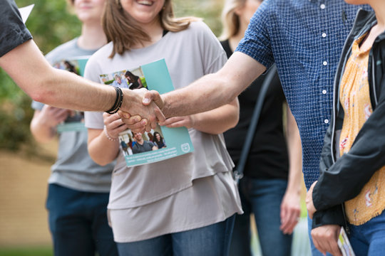 Tour: Parent Of Student Shakes Hand With Guide