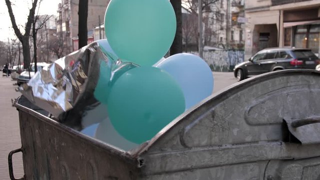Bunch of balloons in garbage bin for non recycle products