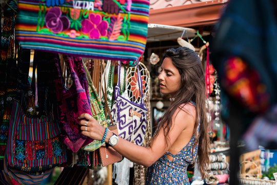 Woman searching for souvenirs at the street market
