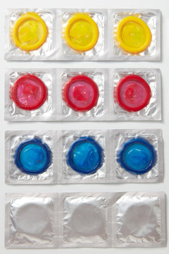 Rows of colorful condoms packs.