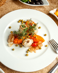 fish rolls served with boiled vegetables and dill